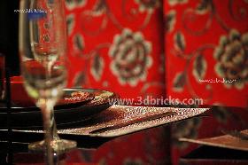 Golden Table mat complimenting the fabric wall